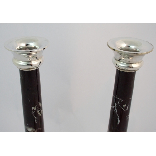 155 - A pair of silver candlesticks