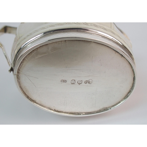 162 - A three piece silver tea service with teapot stand