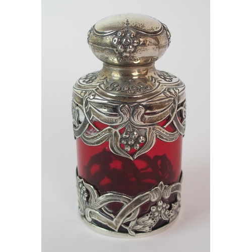 193 - An Edwardian silver mounted cranberry glass scent bottle