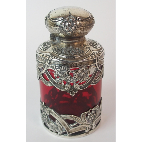 193 - An Edwardian silver mounted cranberry glass scent bottle