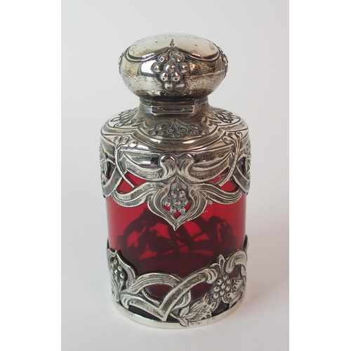 193 - An Edwardian silver mounted cranberry glass scent bottle