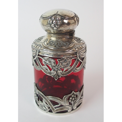 193 - An Edwardian silver mounted cranberry glass scent bottle