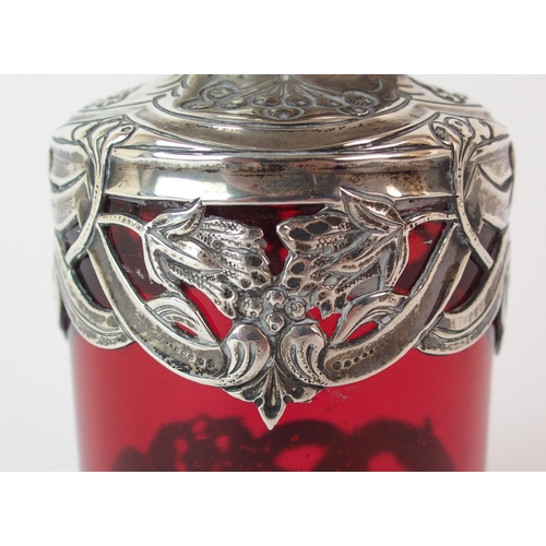 193 - An Edwardian silver mounted cranberry glass scent bottle