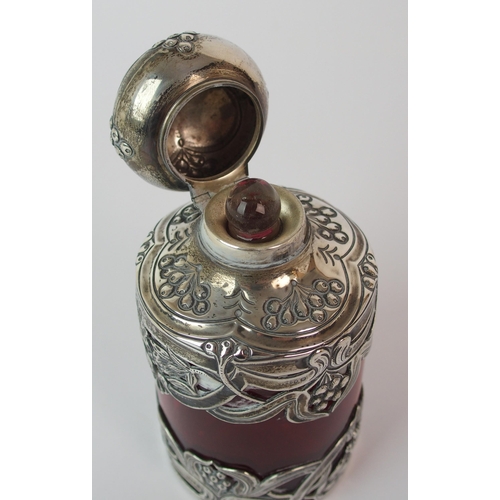 193 - An Edwardian silver mounted cranberry glass scent bottle