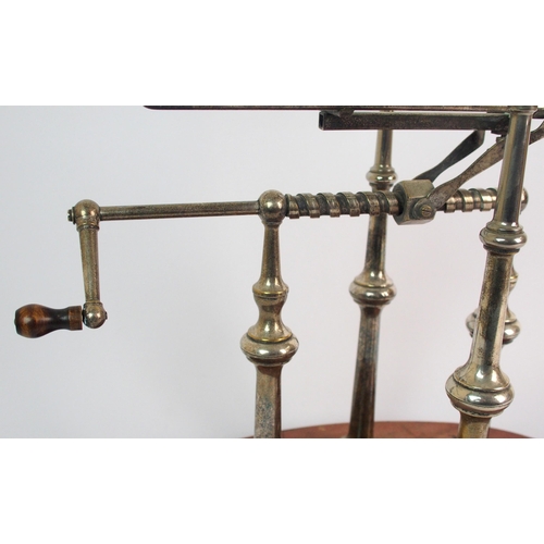 276 - A silver plated wine bottle decanting cradle