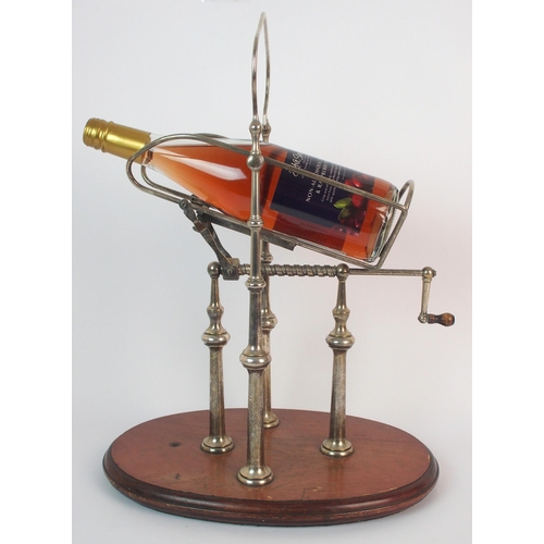 276 - A silver plated wine bottle decanting cradle