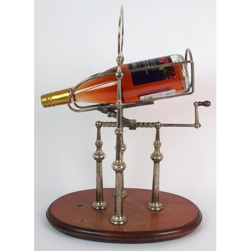 276 - A silver plated wine bottle decanting cradle