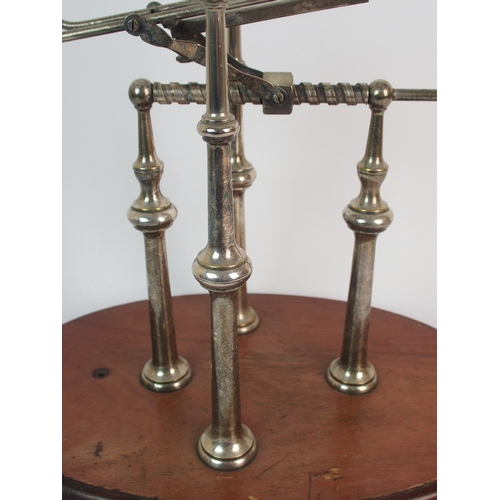 276 - A silver plated wine bottle decanting cradle