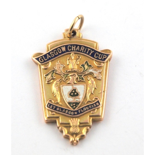 322 - A 9ct gold and enamel 1937-38 Glasgow Charity Cup Winners medal