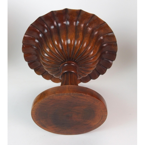 404 - A pair of fluted mahogany urns and covers