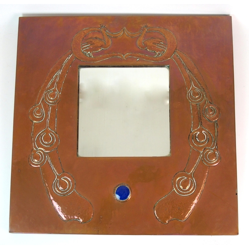 412 - An Arts and Crafts style copper wall mirror