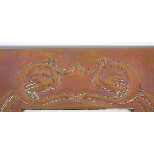 412 - An Arts and Crafts style copper wall mirror