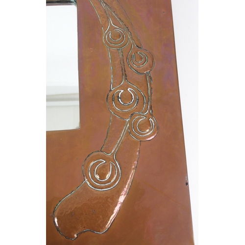 412 - An Arts and Crafts style copper wall mirror