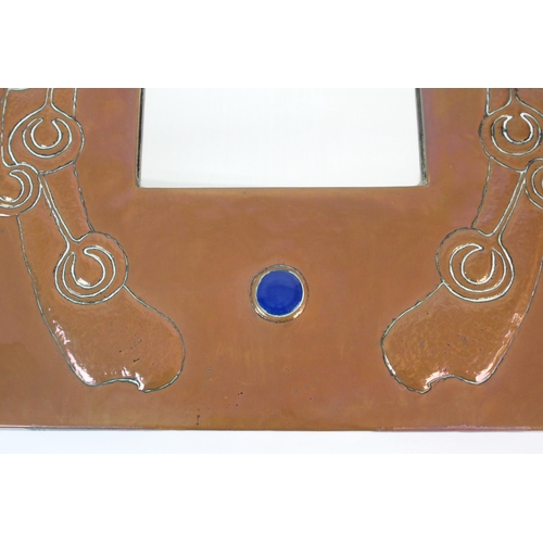 412 - An Arts and Crafts style copper wall mirror