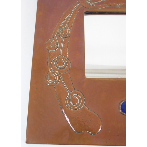 412 - An Arts and Crafts style copper wall mirror