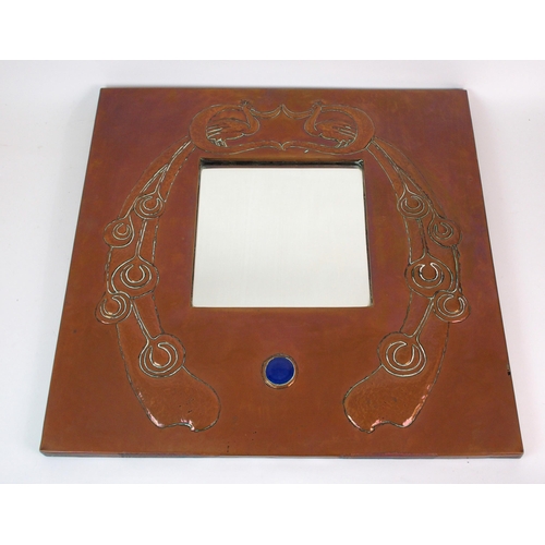 412 - An Arts and Crafts style copper wall mirror