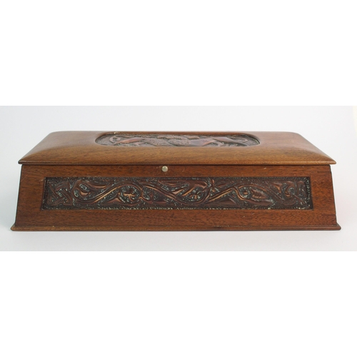 413 - A Celtic revival copper and wood casket in the style of Alexander Ritchie