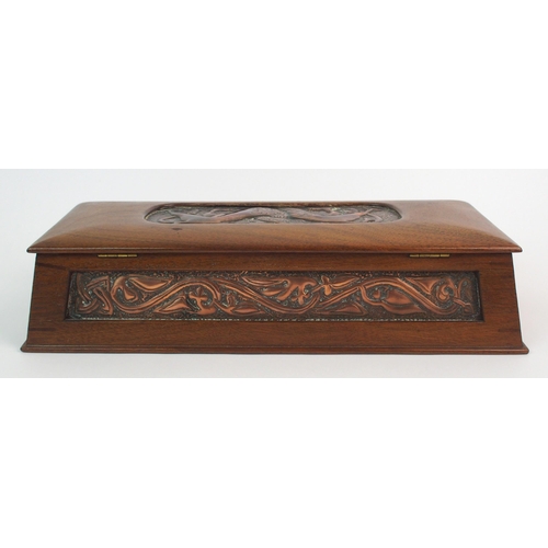 413 - A Celtic revival copper and wood casket in the style of Alexander Ritchie