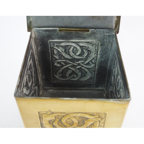 414 - A Celtic revival brass tea caddy in the style of Alexander Ritchie