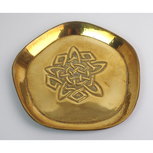 416 - Two Celtic revival brass trays in the style of Alexander Ritchie