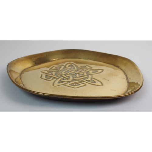 416 - Two Celtic revival brass trays in the style of Alexander Ritchie