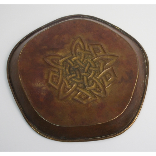 416 - Two Celtic revival brass trays in the style of Alexander Ritchie