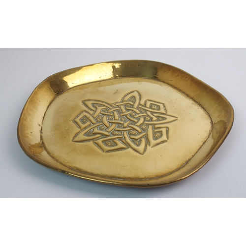 416 - Two Celtic revival brass trays in the style of Alexander Ritchie