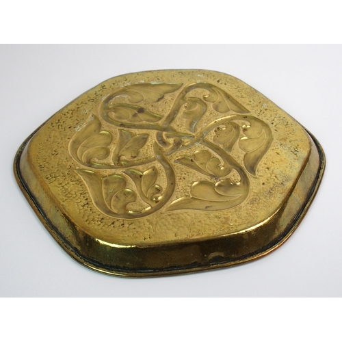 416 - Two Celtic revival brass trays in the style of Alexander Ritchie