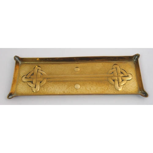 417 - A Celtic revival brass ashtray in the style of Alexander Ritchie