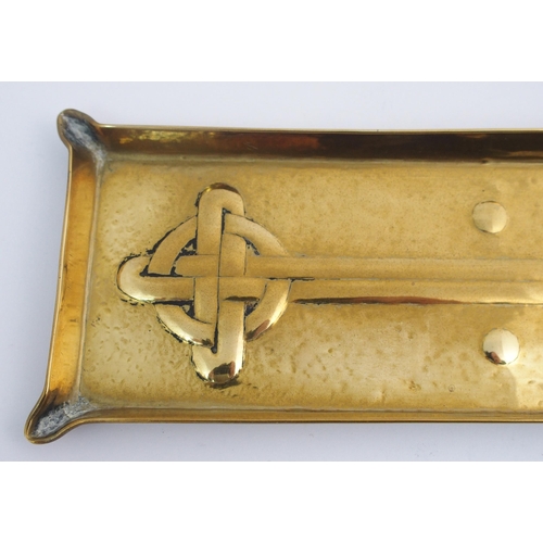 417 - A Celtic revival brass ashtray in the style of Alexander Ritchie