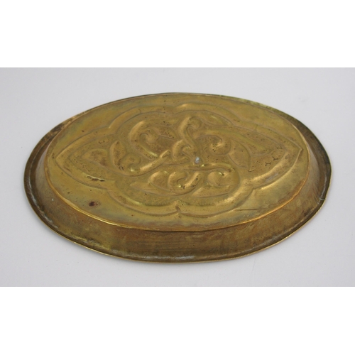 417 - A Celtic revival brass ashtray in the style of Alexander Ritchie