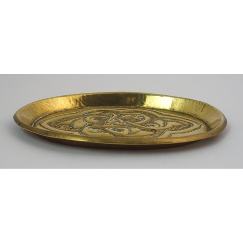 417 - A Celtic revival brass ashtray in the style of Alexander Ritchie