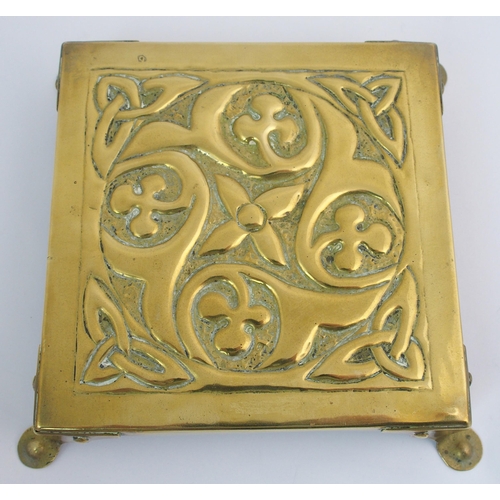 417 - A Celtic revival brass ashtray in the style of Alexander Ritchie