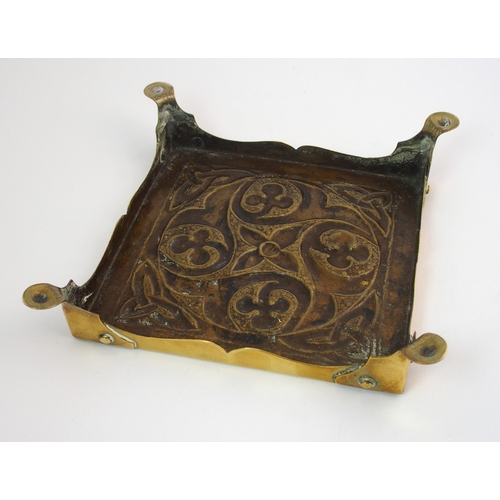 417 - A Celtic revival brass ashtray in the style of Alexander Ritchie