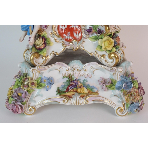 448 - A German porcelain clockcase and stand