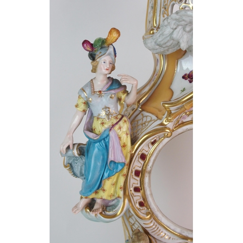 448 - A German porcelain clockcase and stand