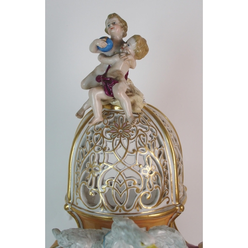 448 - A German porcelain clockcase and stand