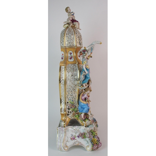 448 - A German porcelain clockcase and stand