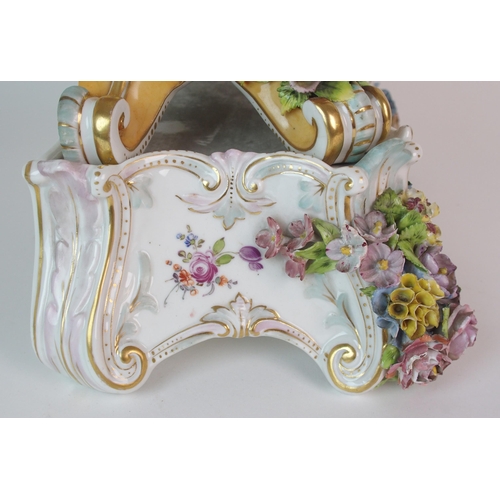 448 - A German porcelain clockcase and stand