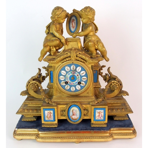 464 - A Louis XV style gilt metal mantle clock