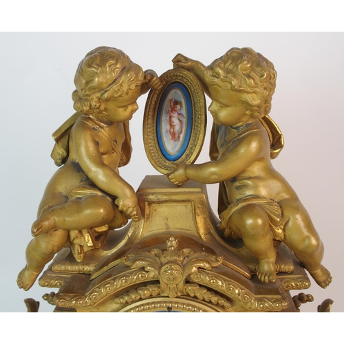 464 - A Louis XV style gilt metal mantle clock