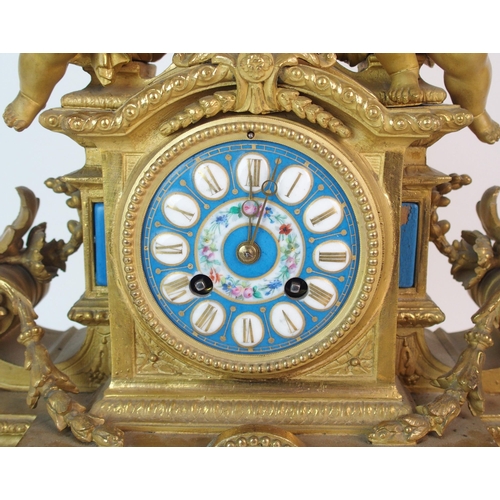 464 - A Louis XV style gilt metal mantle clock