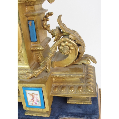 464 - A Louis XV style gilt metal mantle clock