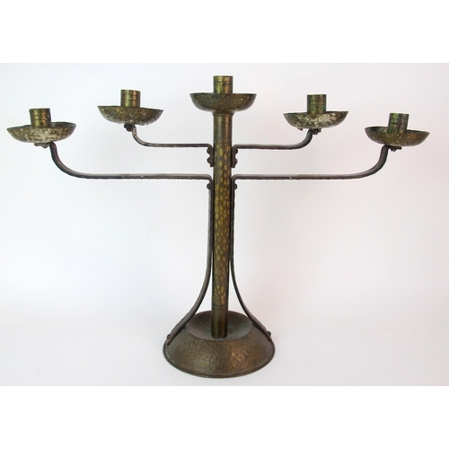 471 - A Coburg style hammered copper and wrought iron four branch candelabra