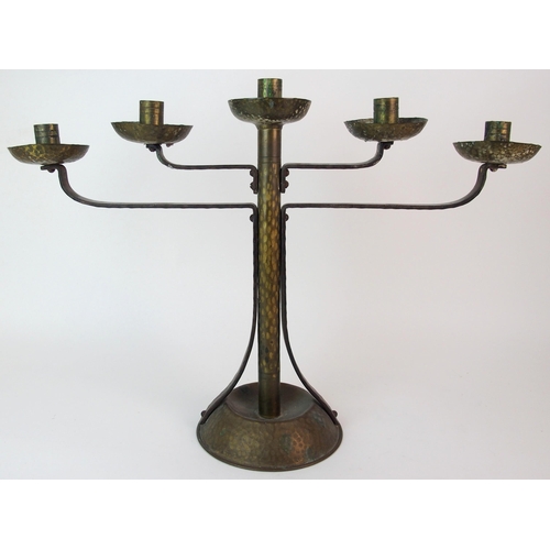 471 - A Coburg style hammered copper and wrought iron four branch candelabra