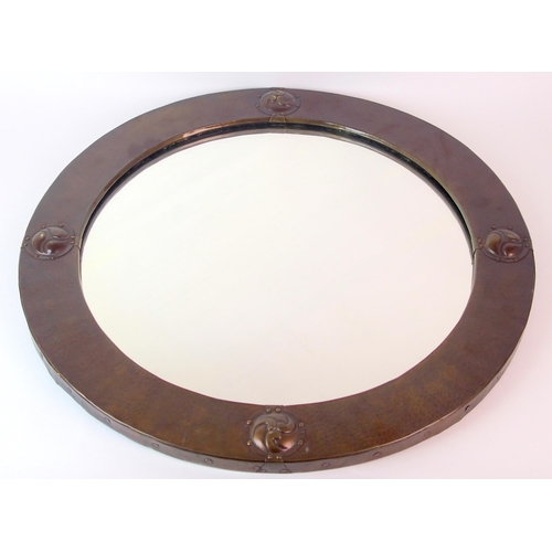 494 - A Liberty & Co. circular patinated copper brass mirror