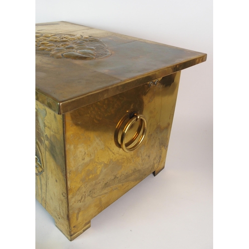 506 - A Glasgow School Arts and Crafts brass repousse work log box