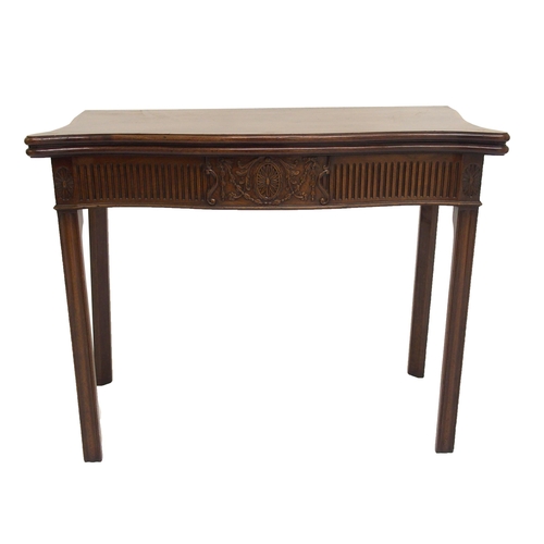 761 - A George III style mahogany serpentine shaped fold over card table