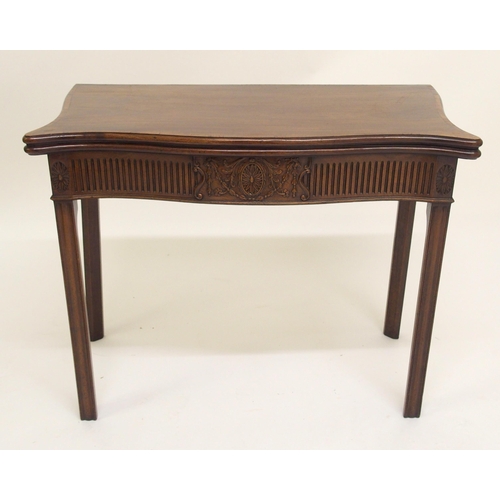 761 - A George III style mahogany serpentine shaped fold over card table