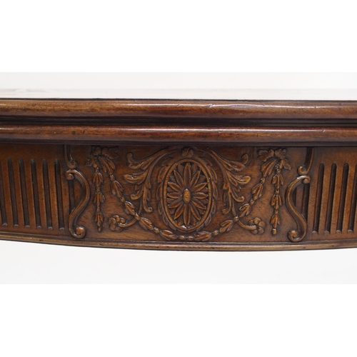 761 - A George III style mahogany serpentine shaped fold over card table